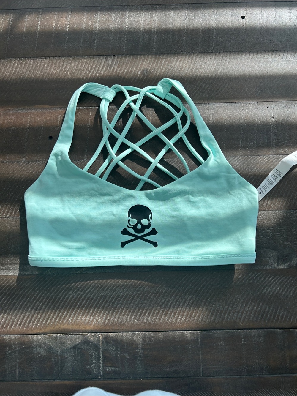 lululemon athletica Aqua Crisscross Back with Black Skull Graphic